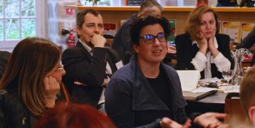 A person talking among a group